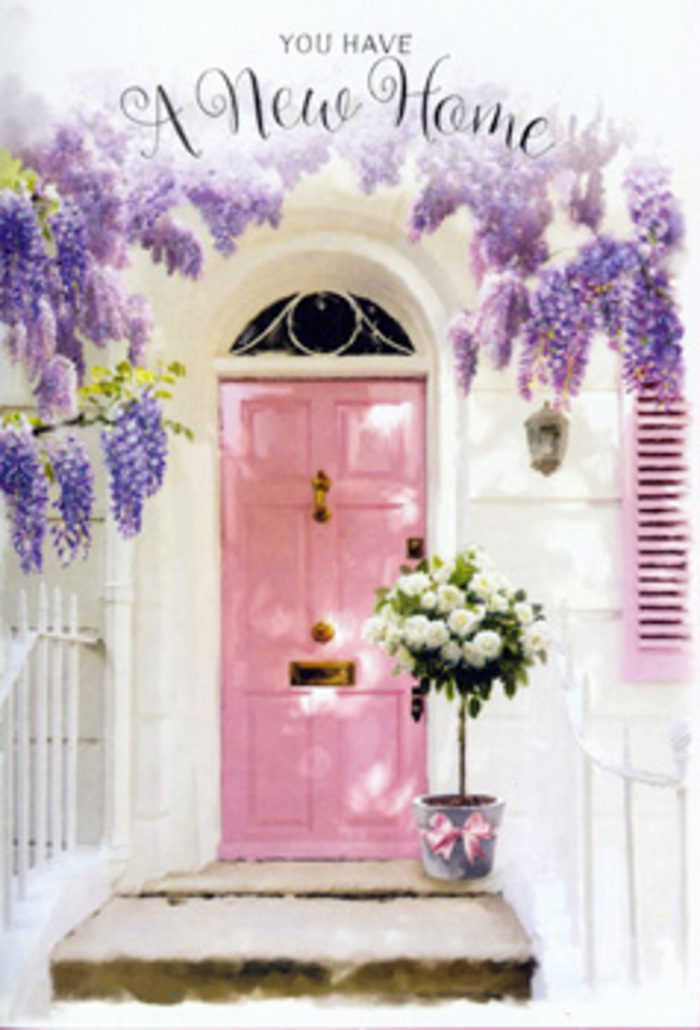 Stepping up to this Holloway doorway, you can imagine the rustle of moving boxes just inside and the soft thud of footsteps as someone explores their new home for the first time. Outside, the entrance has been transformed into a floral vignette that feels both intimate and celebratory. Wisteria trails luxuriantly from above, its blossoms hanging in loose, fragrant clusters of lavender, lilac, and pale purple that sway gently in the breeze. They frame a pastel pink front door whose colour sits somewhere between blush and rose, glowing against the crisp whitewashed wall. One shutter, painted in the same delicate tone, leans open as though to let in a little extra North London light, much like the houses edging the quieter roads off Holloway Road. The sunlight here is soft and flattering, the sort of gentle brightness that makes every petal look velvety and every shadow seem kind. At the foot of the door, slightly off-centre on the stone step, is a metal bucket in cool grey, simple and unpolished. It overflows with creamy white roses, their petals densely layered and softly curled at the edges, each bloom nestled close to the next. Small sprays of fresh greenery weave between the blossoms, adding texture and a hint of wildness to the otherwise classic arrangement. Around the bucket, a pale pink satin ribbon has been tied into a relaxed bow, its trailing ends resting naturally against the metal. You can almost smell the sweetness of the roses, imagine brushing past the wisteria as you reach for the handle, and feel the quiet thrum of anticipation that comes with a new beginning in Holloway. It's a florist's way of saying: this place is ready for laughter, for guests, and for all the stories yet to unfold.